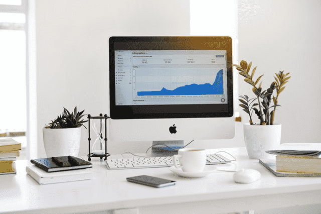Desktop analytics dashboard representing IT project delivery and advisory services