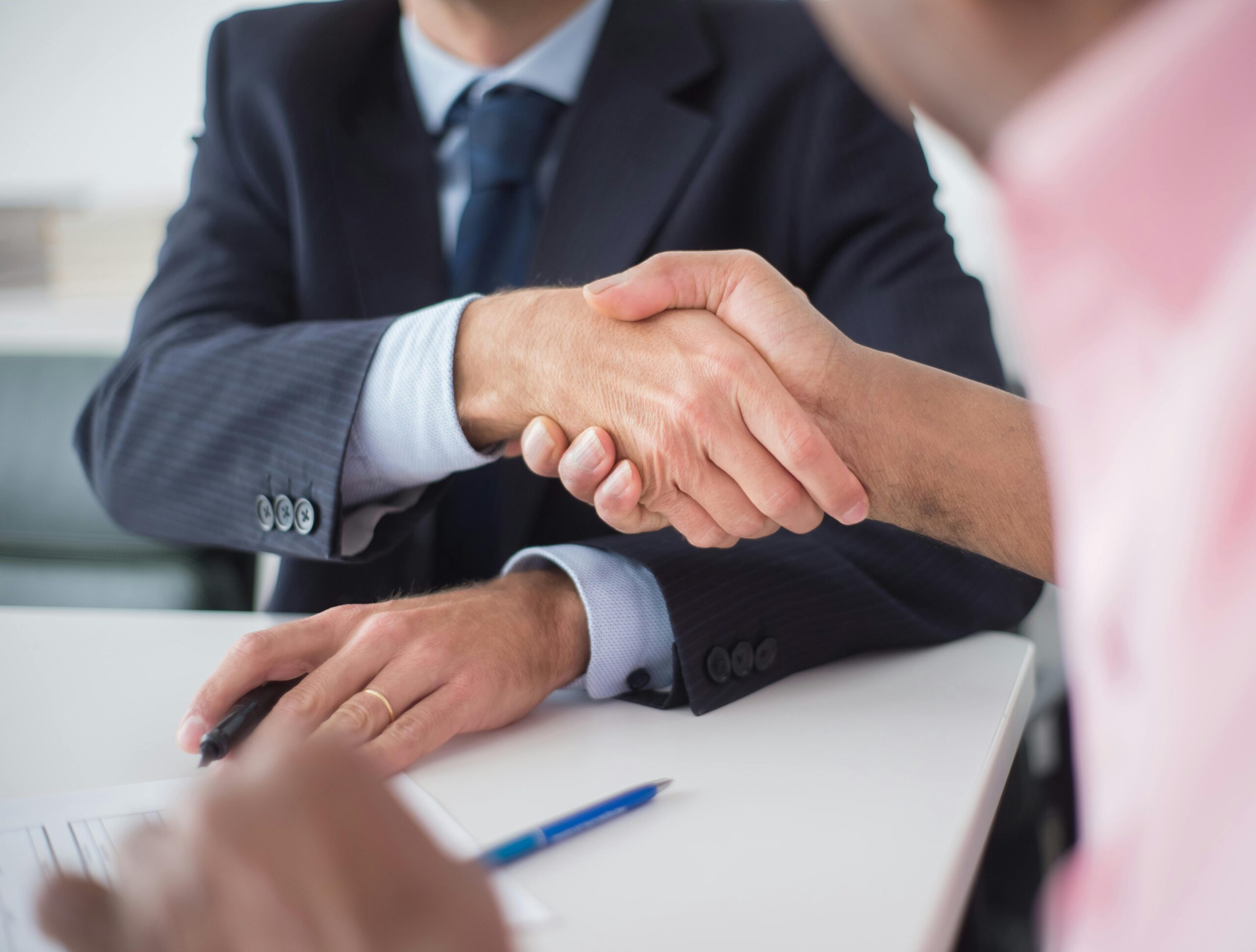 Handshake deal on a merger or acquisition preparing for IT infrastructure alligment between companies