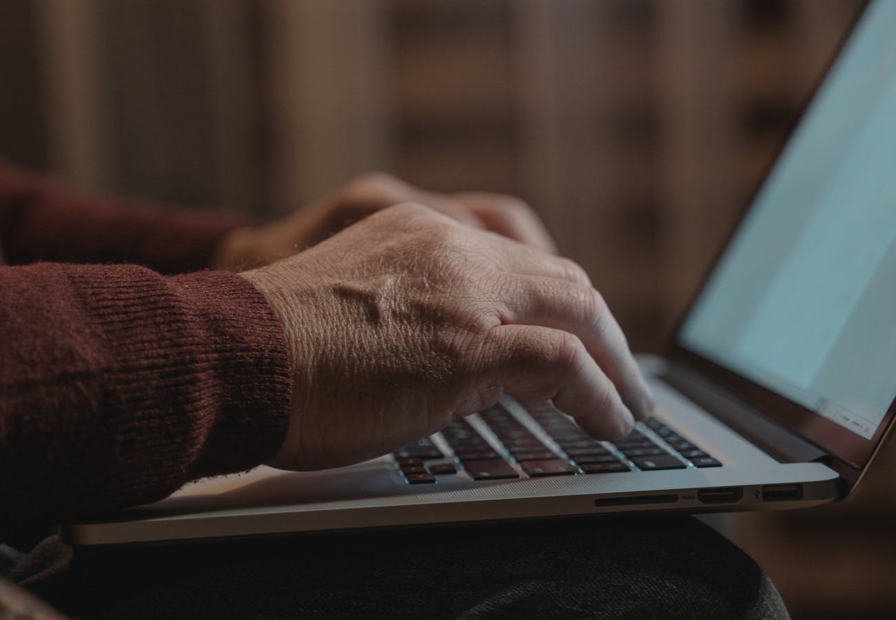 Hands typing on a laptop representing vendor and MSP management support